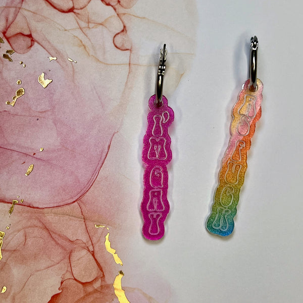 Gay As Fuck Earrings in rainbow magic